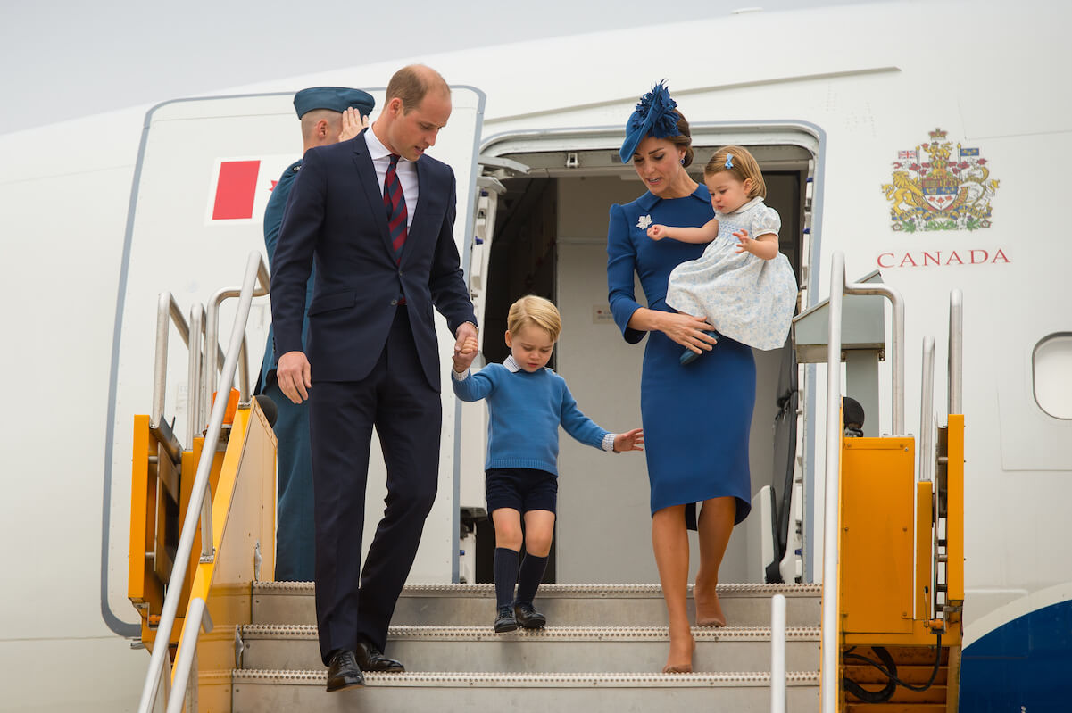 Prince William, Kate Middleton, and Prince George and Princess Charlotte leaving an airplane