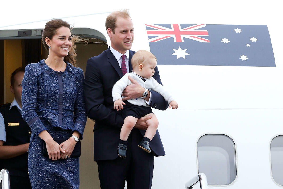 Prince William, Kate Middleton, and Prince George outside of an airplane