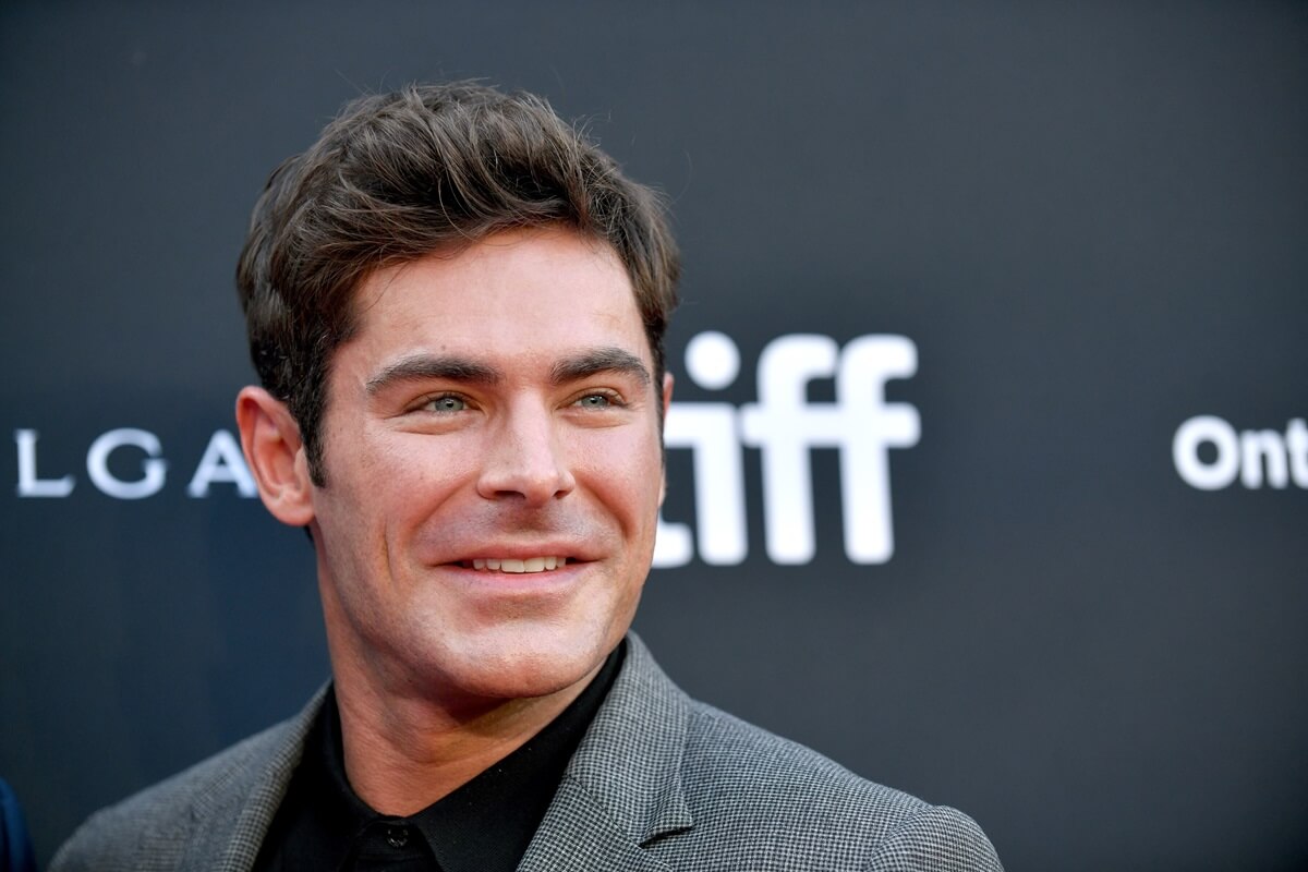 Zac Efron at the premiere of "The Greatest Beer Run Ever" while wearing a grey and black suit.