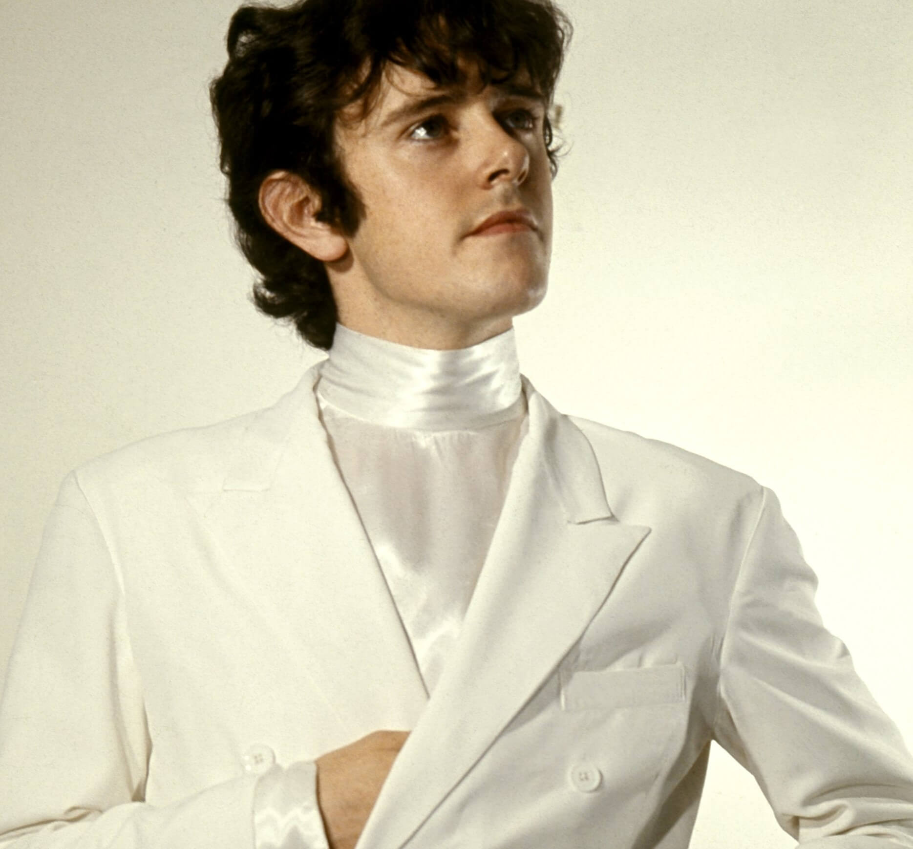 Donovan in a white suit