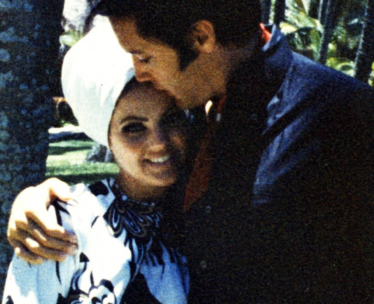 Elvis Presley kissing Priscilla Presley
