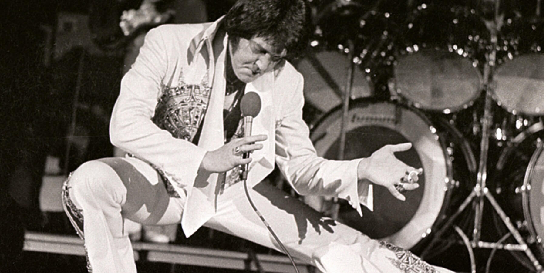 Elvis Presley in concert in April 1977, four months before his death at the age of 42.