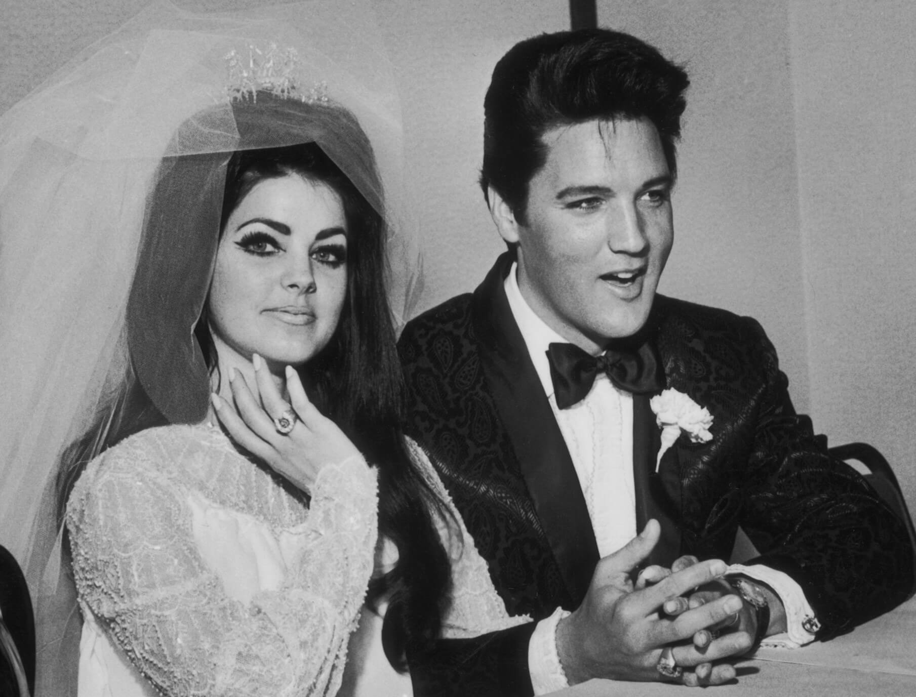 Priscilla Presley and Elvis Presley at their wedding