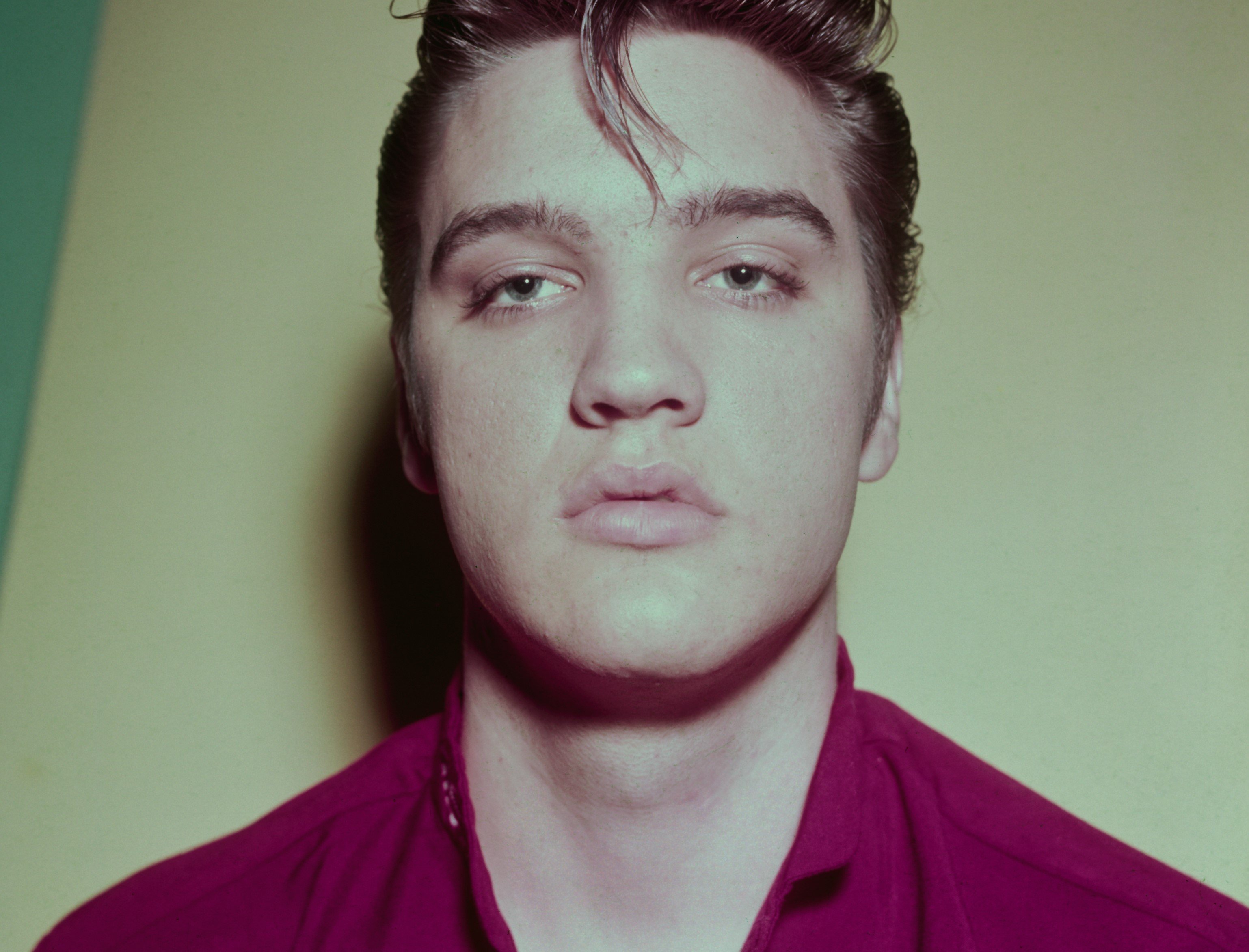 Elvis Presley wearing purple
