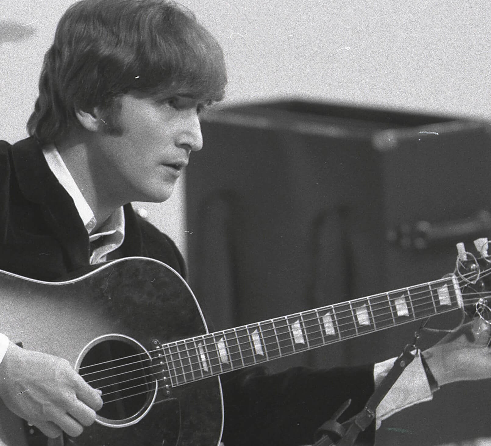 John Lennon with his guitar