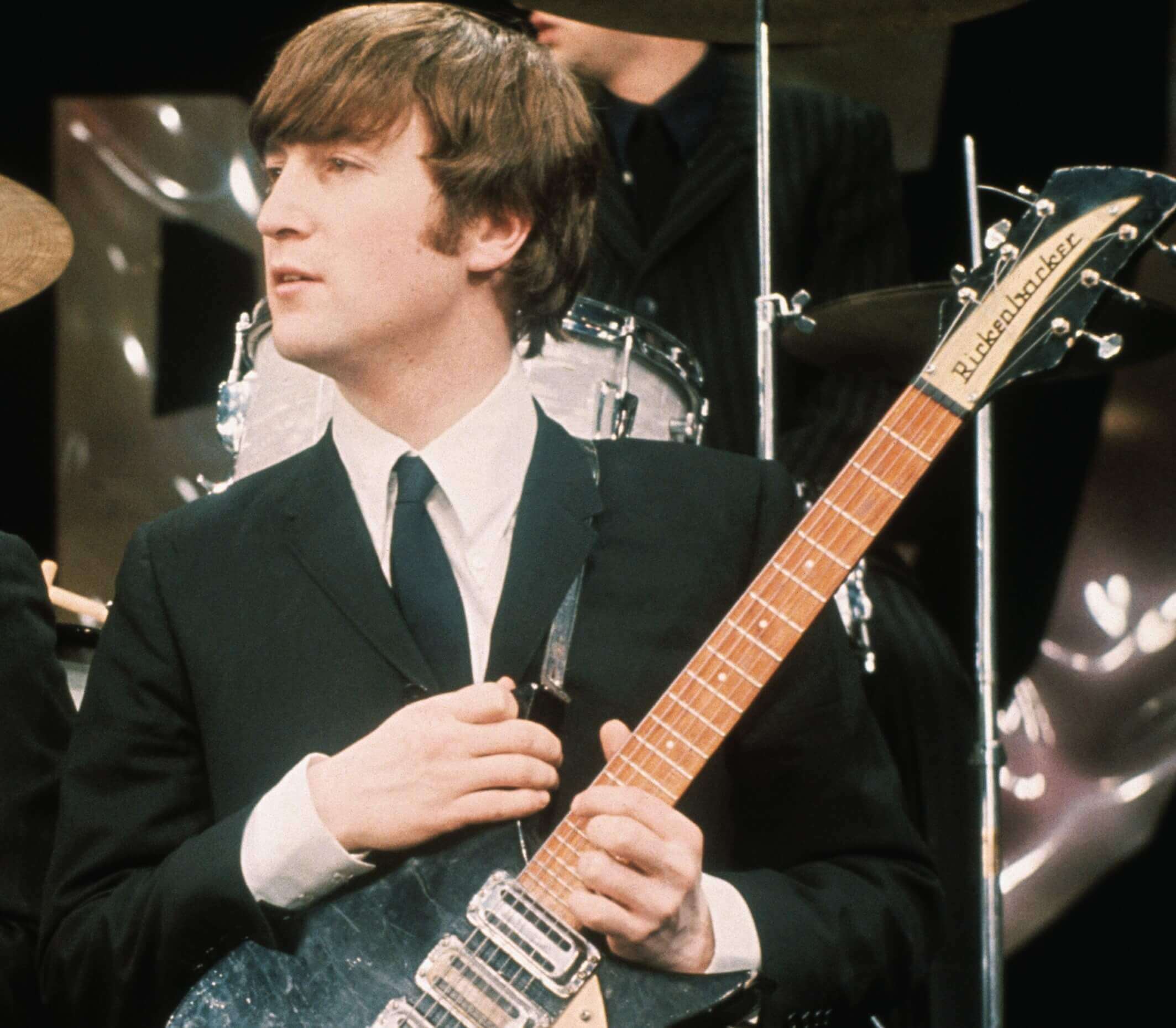 John Lennon holding a guitar