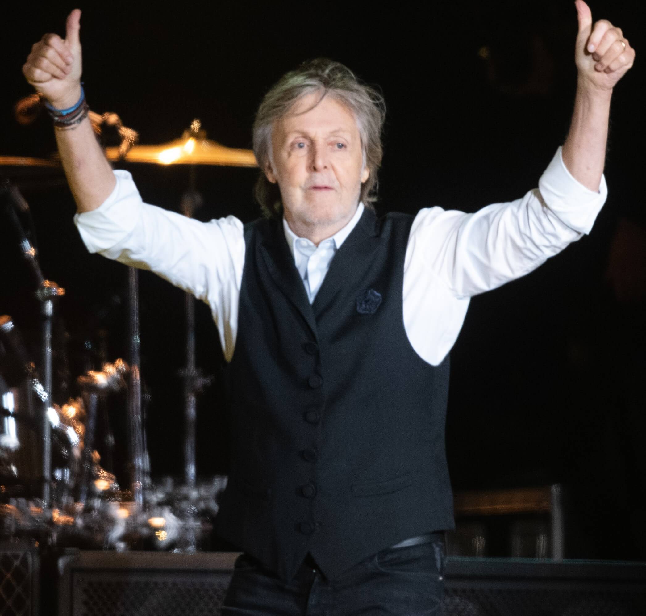 Paul McCartney raising his arms