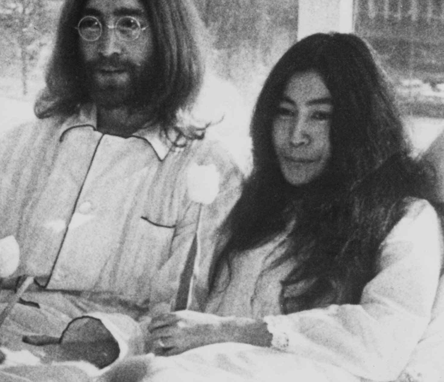 John Lennon and Yoko Ono in bed