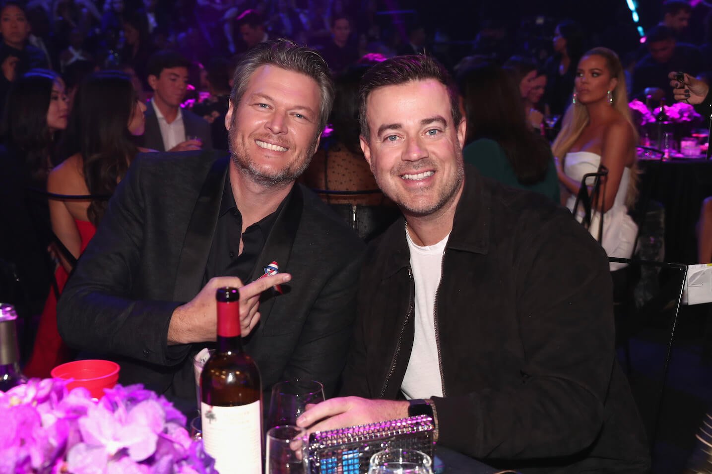 'The Voice' coach Blake Shelton smiling next to host Carson Daly