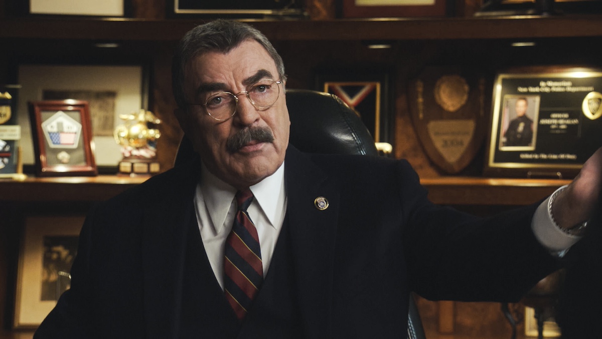 Tom Selleck as Frank Reagan in a suit and tie and wearing glasses in 'Blue Bloods' on CBS