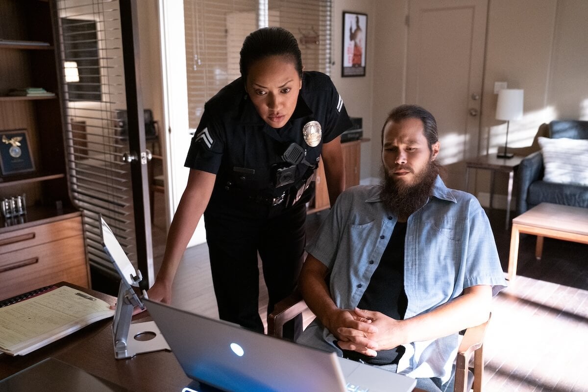 Reina Vasquez (Denise Sanchez) and Mo Bassi (Stephen A. Chang) looking at a computer screen in 'Bosch: Legacy' Season 2