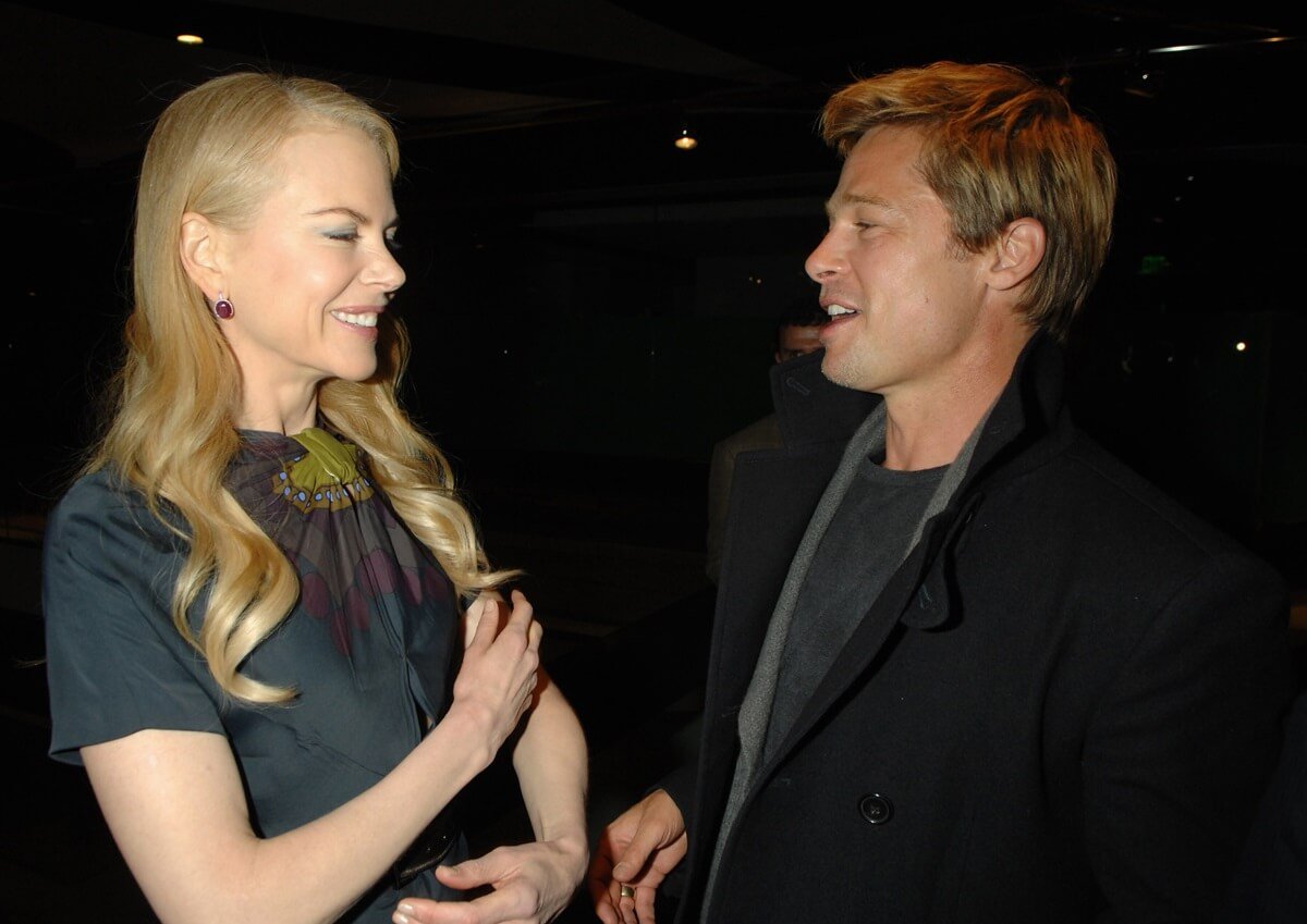 Nicole Kidman and Brad Pitt talking while at the premiere of 'God Grew Tired of Us'.
