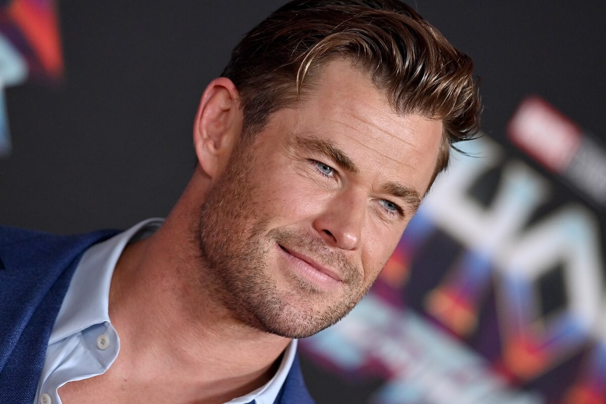 Chris Hemsworth at the premiere of 'Thor: Love and Thunder' posing in a suit.