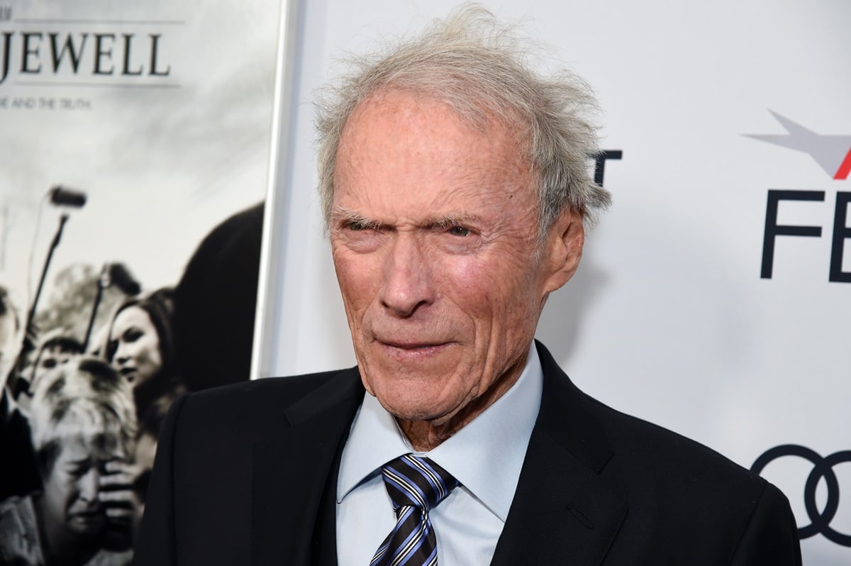 Clint Eastwood posing in a suit at the AFI premiere of 'Richard Jewell'.