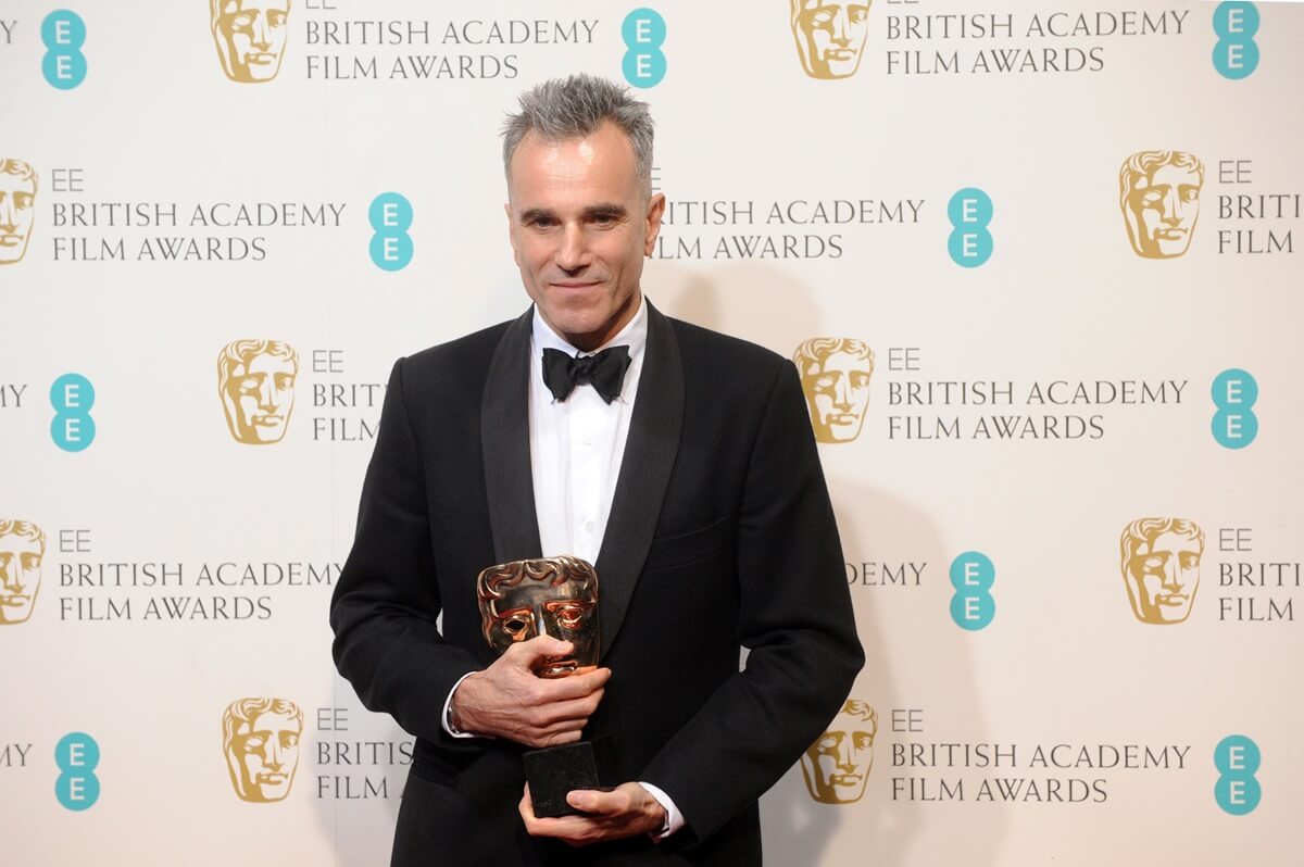 Daniel Day-Lewis posing with a lead actor award for 'Lincoln' at the EE British Academy Film Awards.