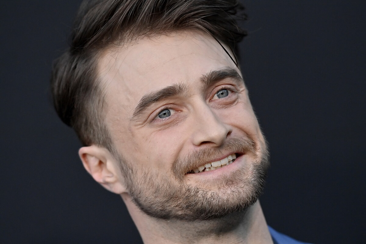 Daniel Radcliffe smiling at the Los Angeles Premiere of 'The Lost City'.