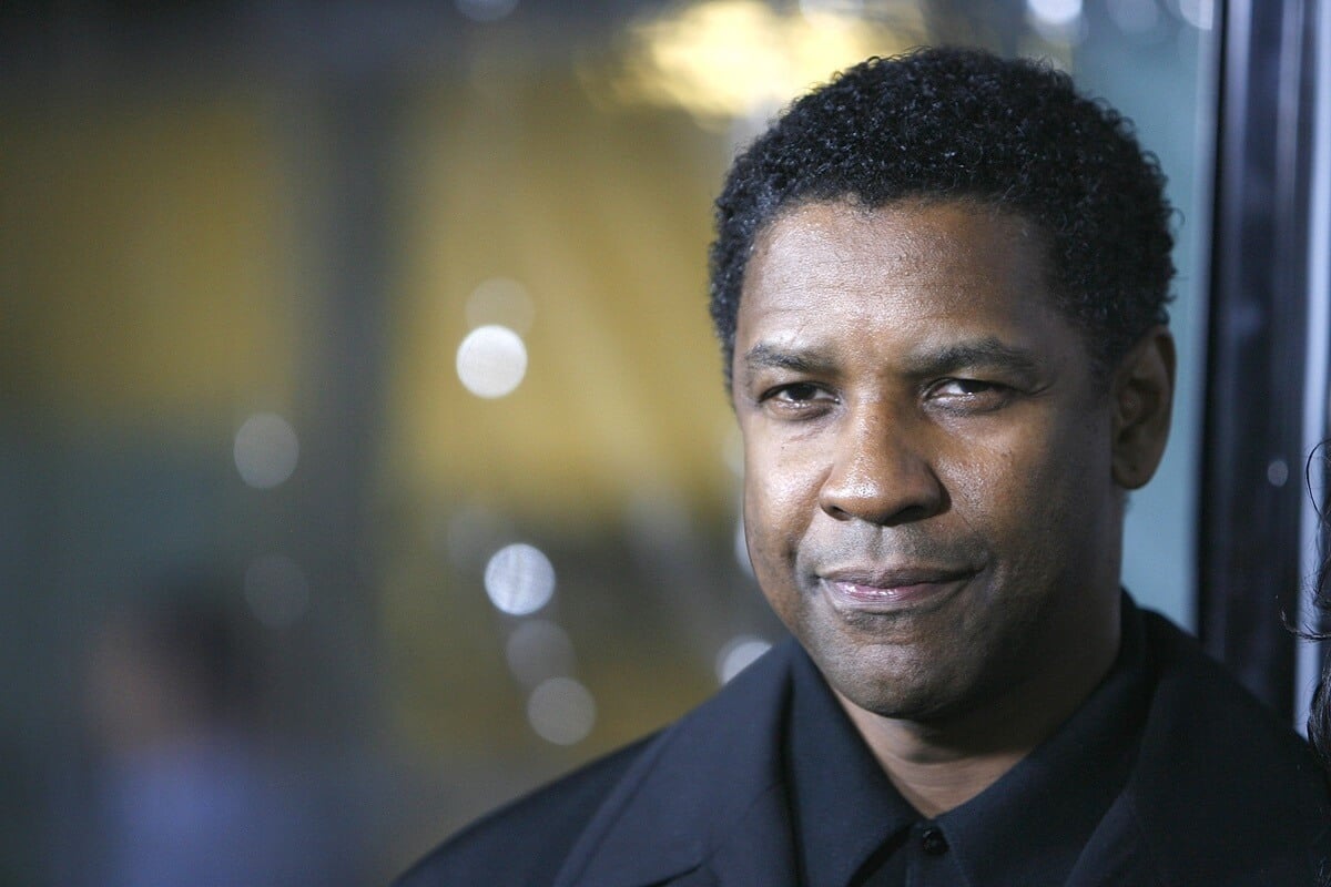 Denzel Washington posing in a suit at the screening of 'American Gangster'.