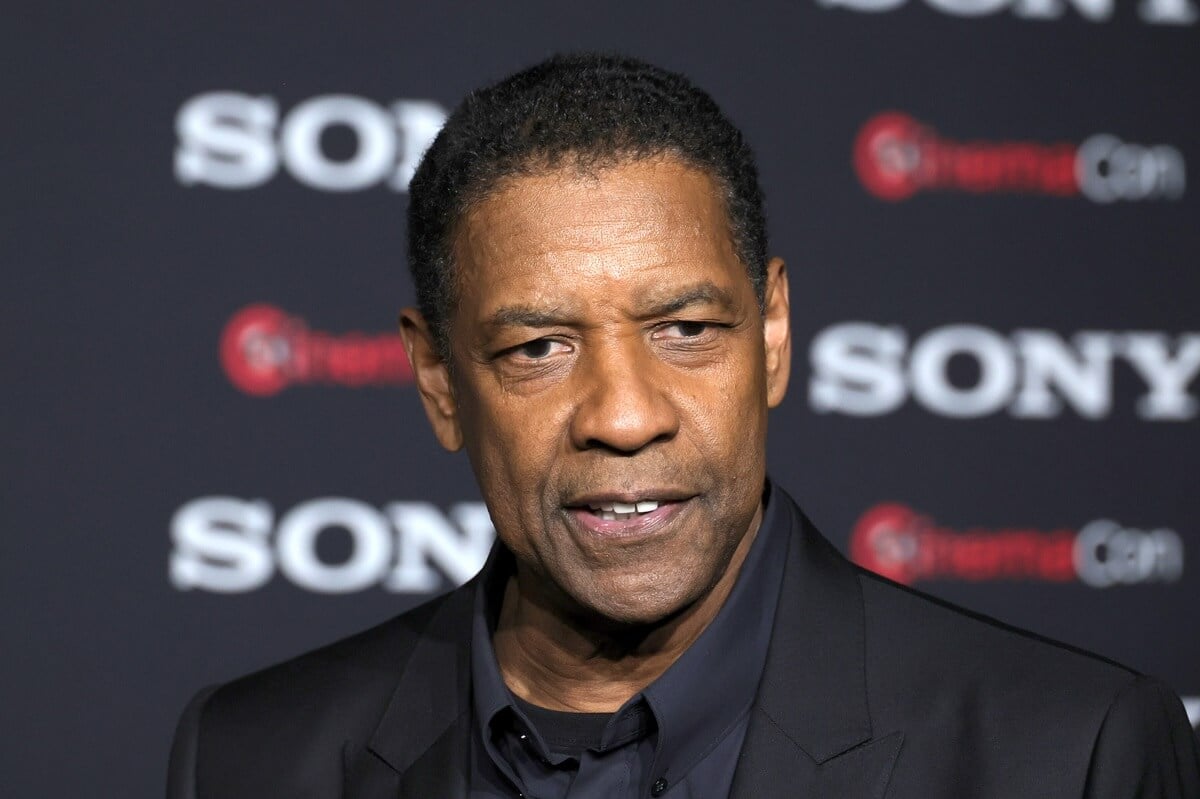 Denzel Washington promoting 'The Equalizer 3' while wearing a black suit.