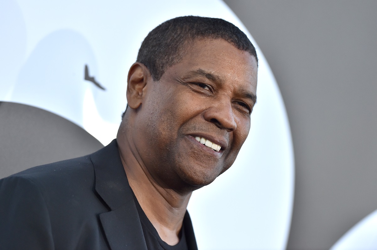 Denzel Washington posing in a black outfit at the premiere of 'The Equalizer 2'.