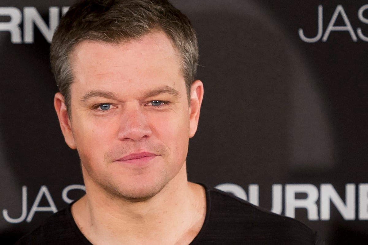 Matt Damon attending a photocall for the feature 'Jason Bourne' in a black shirt.