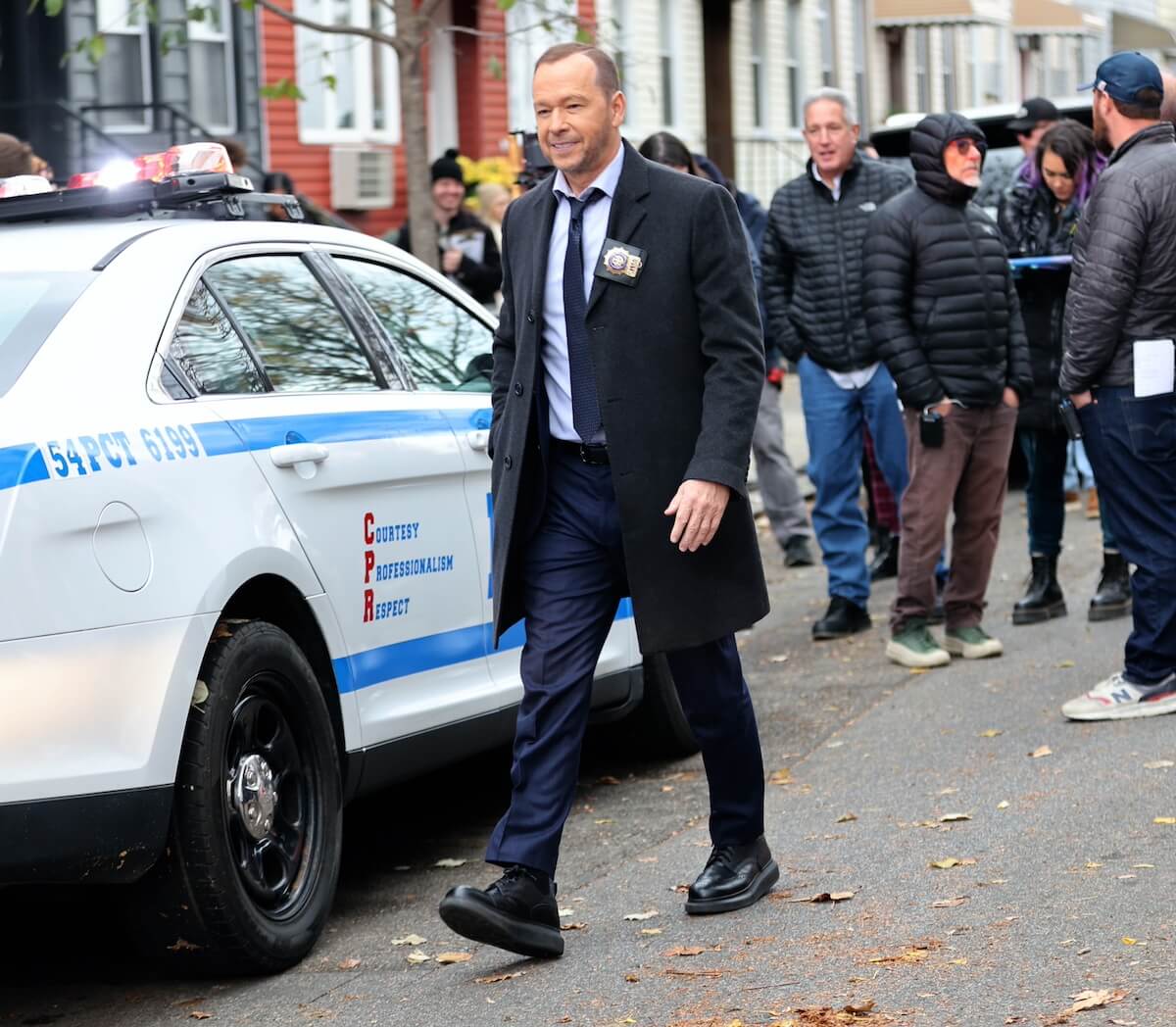 Donnie Wahlberg on a NYC street filming 'Blue Bloods' Season 14