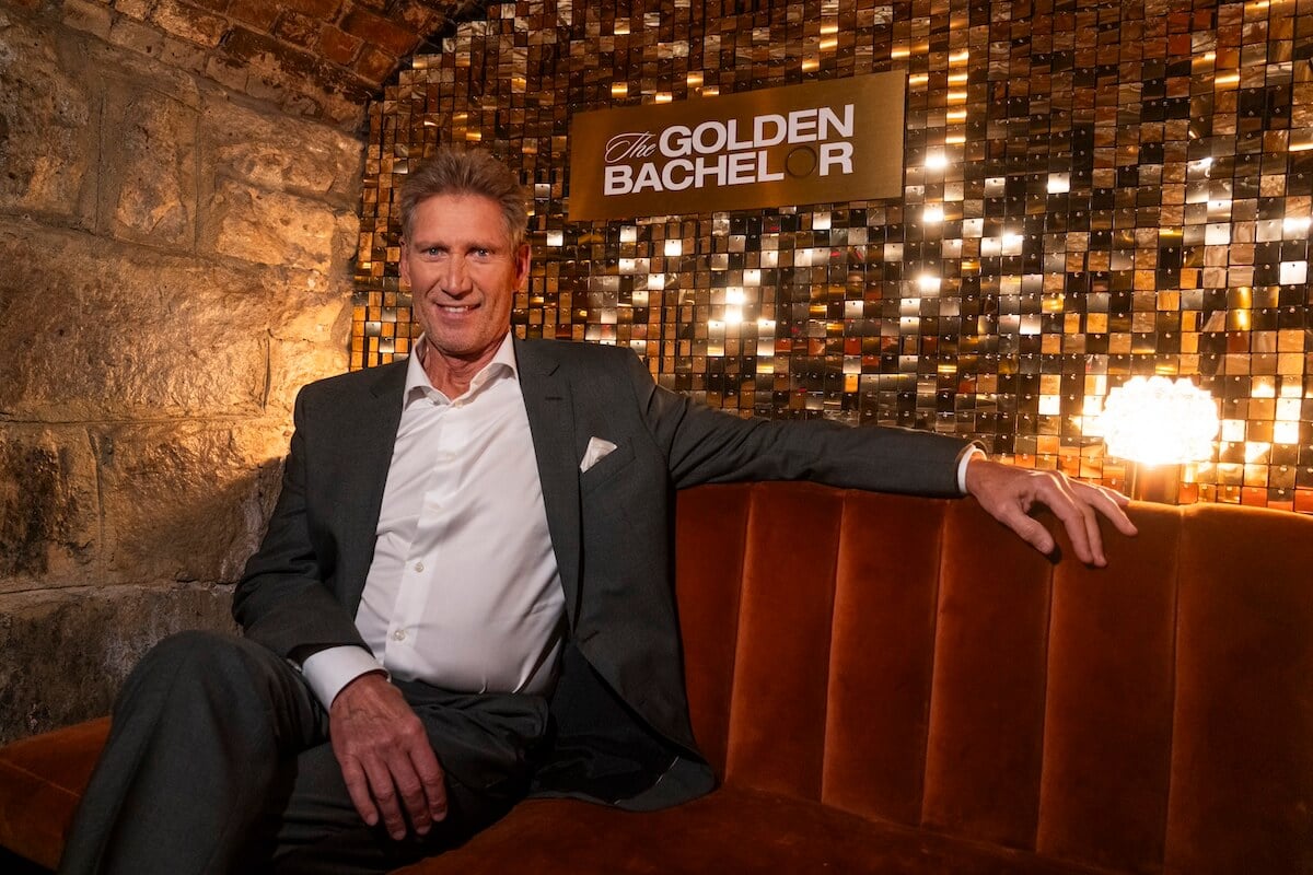 Gerry Turner of 'The Golden Bachelor' sitting on a red banquette