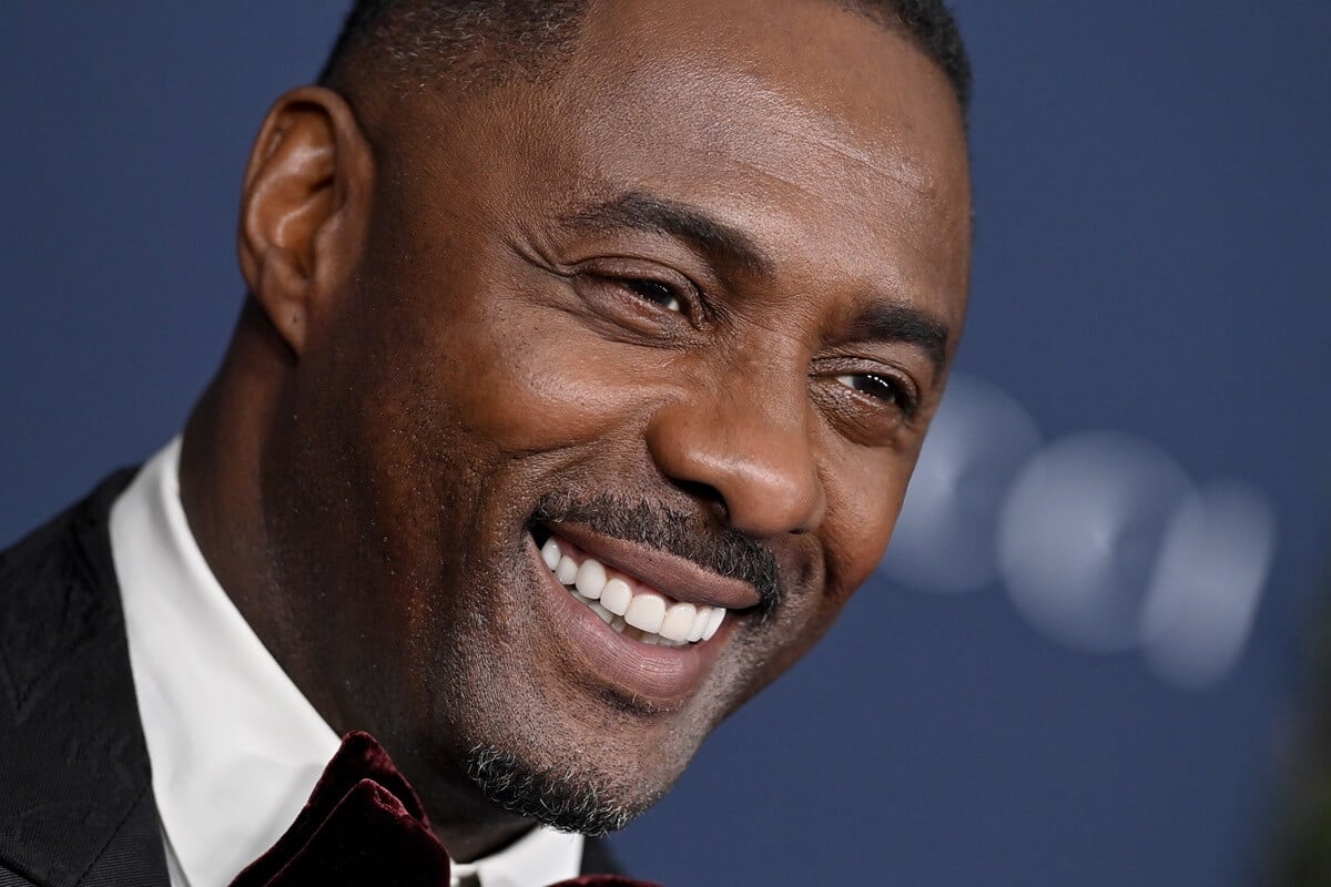 Idris Elba smiling in a suit at the 11th Annual LACMA Art + Film Gala at Los Angeles County Museum of Art.