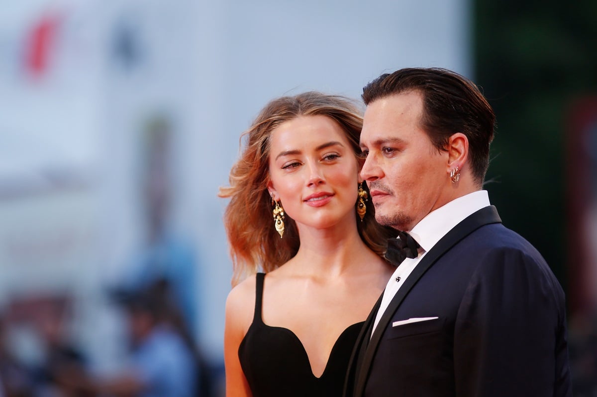 Johnny Depp and Amber Heard posing at the 'Black Mass' premiere.