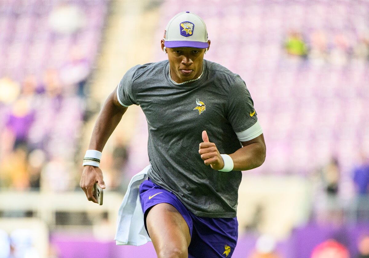 Joshua Dobbs, whose father is of Caucasian ancestry and his mother is of African-American ethnicity, warms up before a game