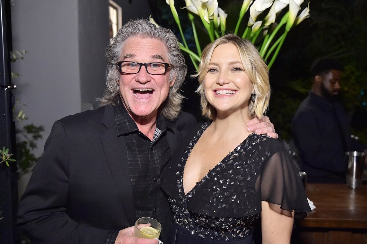 Kate Hudson and Kurt Russell smiling while dressed up at the Michael Kors Dinner to celebrate Kate Hudson and The World Food Programme.