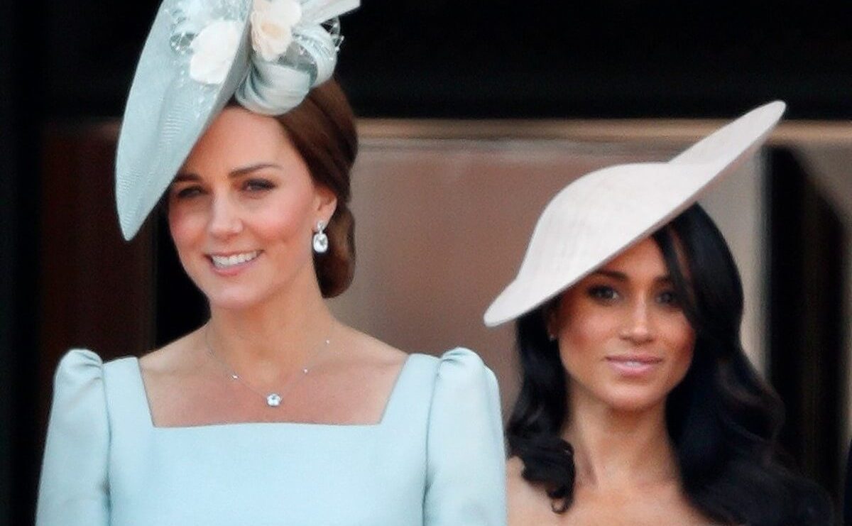 Kate Middleton and Meghan Markle, who an ex-royal employee says doesn't have class like Kate and that's a 'hard pillow to swallow,' stand on the balcony of Buckingham Palace during Trooping The Colour 2018