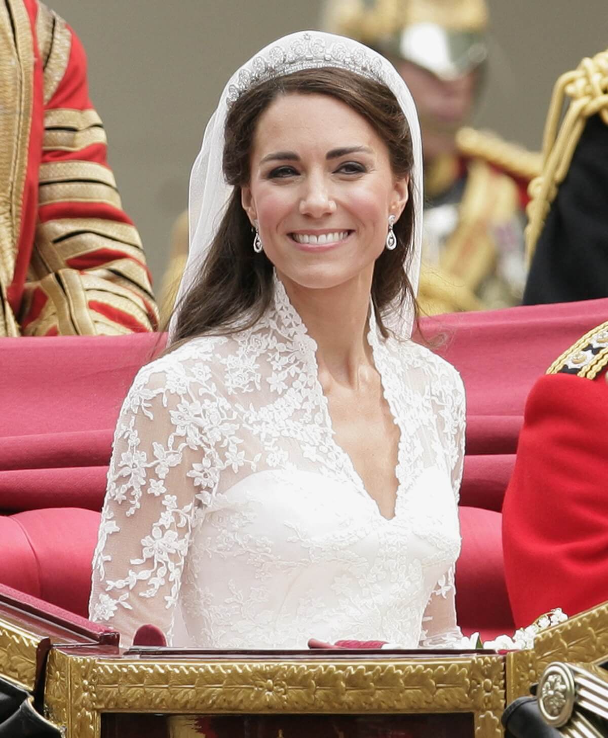 Kate Middleton, who won't even adopt Queen Elizabeth's signature makeup rule, travels to Buckingham Palace in a horse drawn carriage following her royal wedding