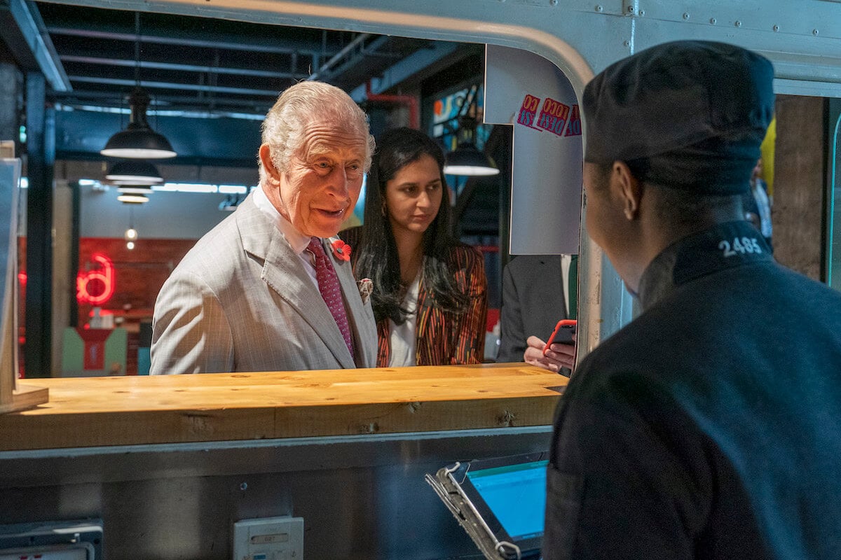 King Charles III at a food truck during a royal tour of Kenya, something Queen Elizabeth II wouldn't have done, per a historian