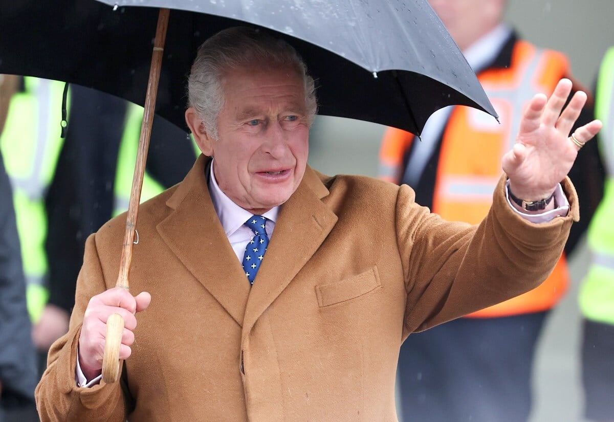 King Charles III waves to well-wishers during the launch of the Coronation Food Project in Didcot, England