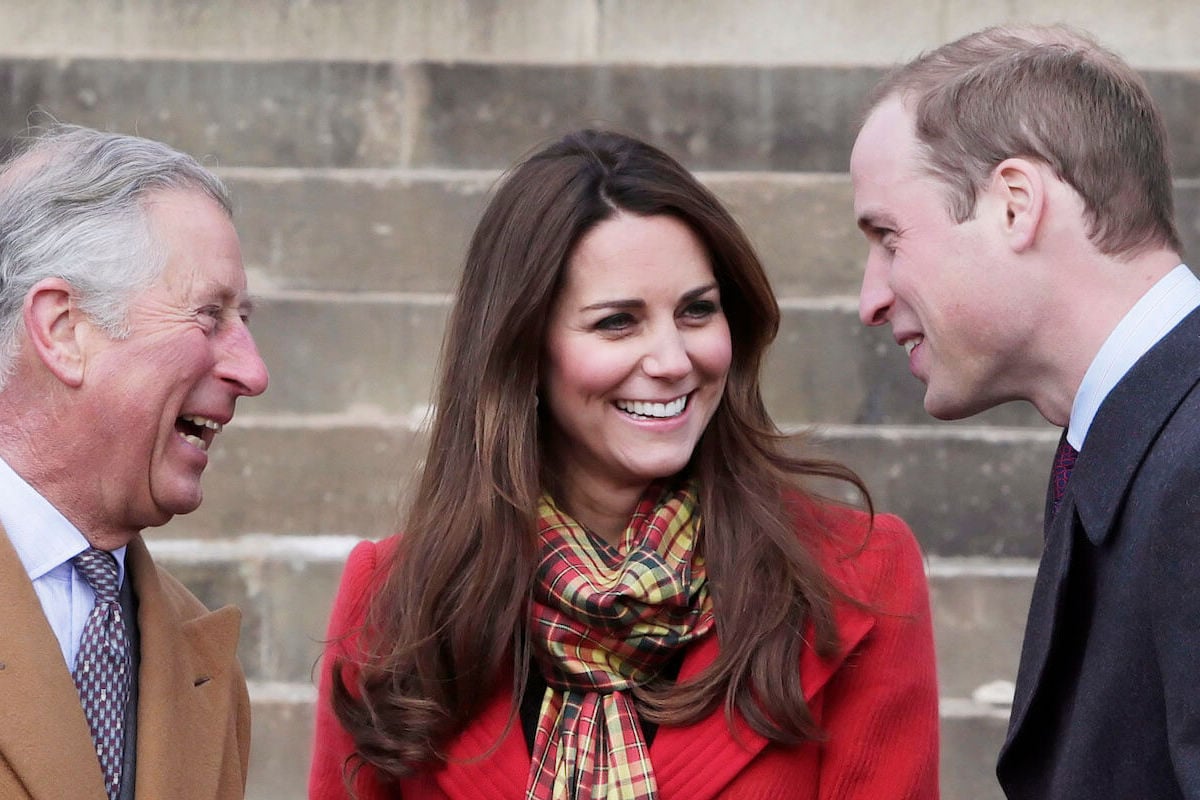 King Charles III, who commented on Prince William and Kate Middleton's engagement, stands with his son and daughter-in-law