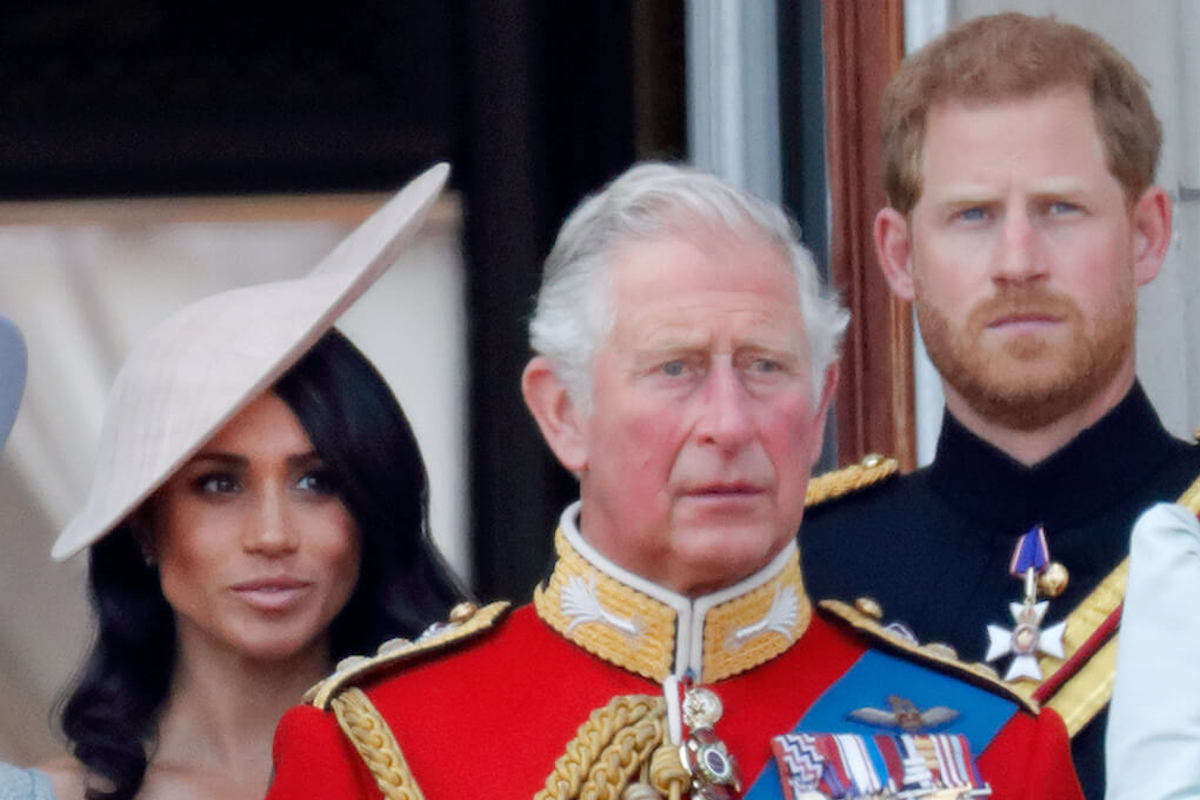 King Charles, whose reaction to 'Harry and Meghan' was initially sadness, per 'Endgame,' stands with Prince Harry and Meghan Markle and other royals