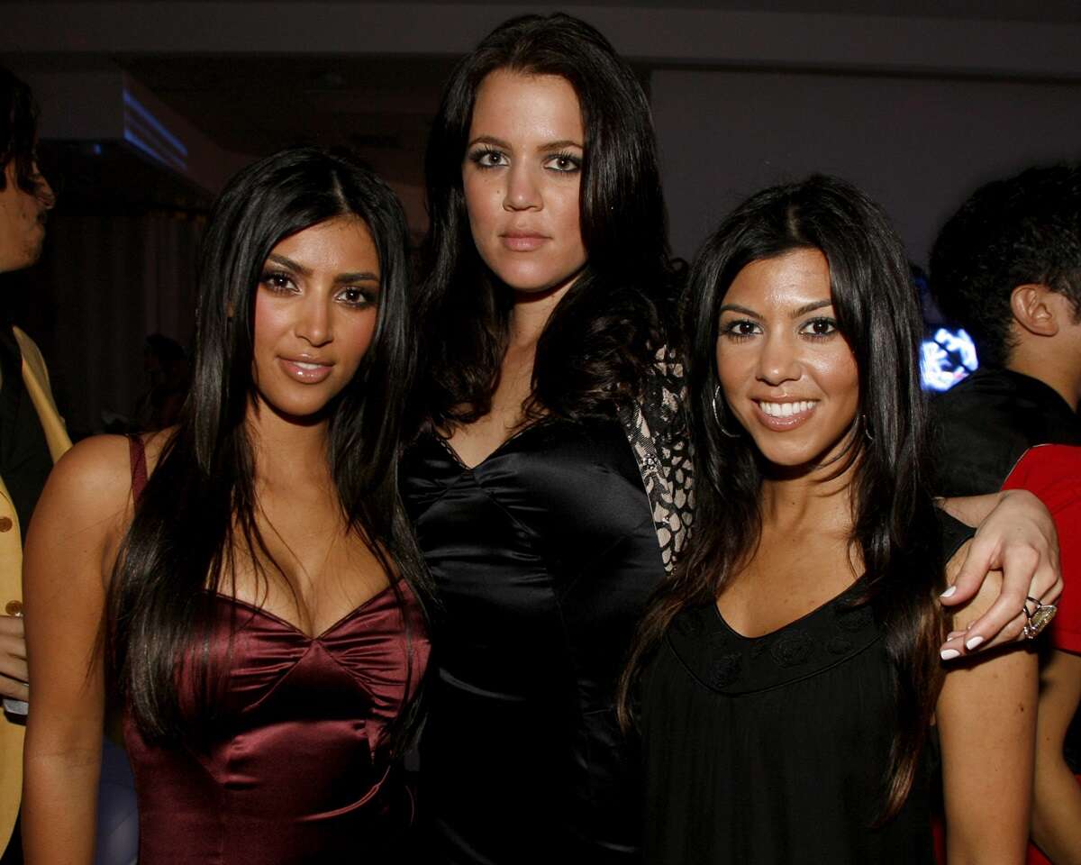Kim Kardashian, Khloe Kardashian, and Kourtney Kardashian are seen together at the Playstation 3 Launch