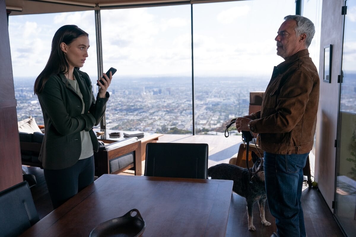 Maddie, holding a phone, standing across from Harry Bosch in the 'Bosch: Legacy' Season 2 finale