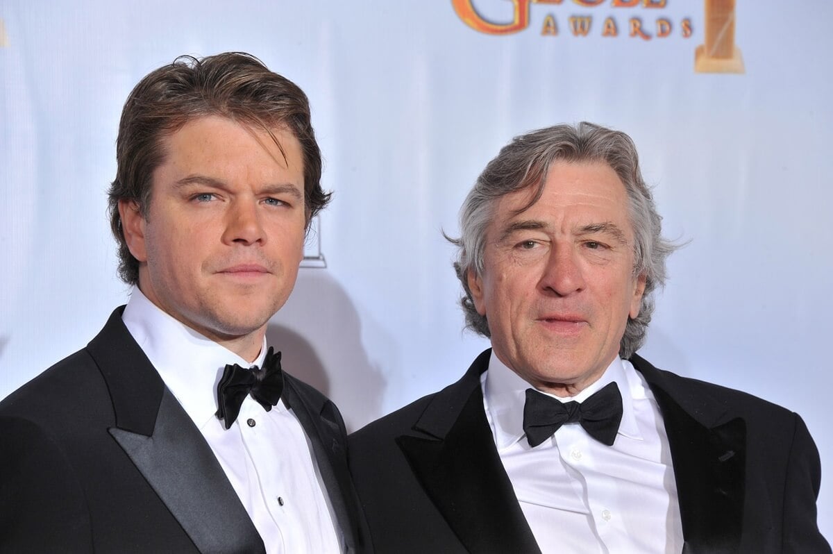 Matt Damon and Robert De Niro at the 68th Annual Golden Globe Awards wearing suits.