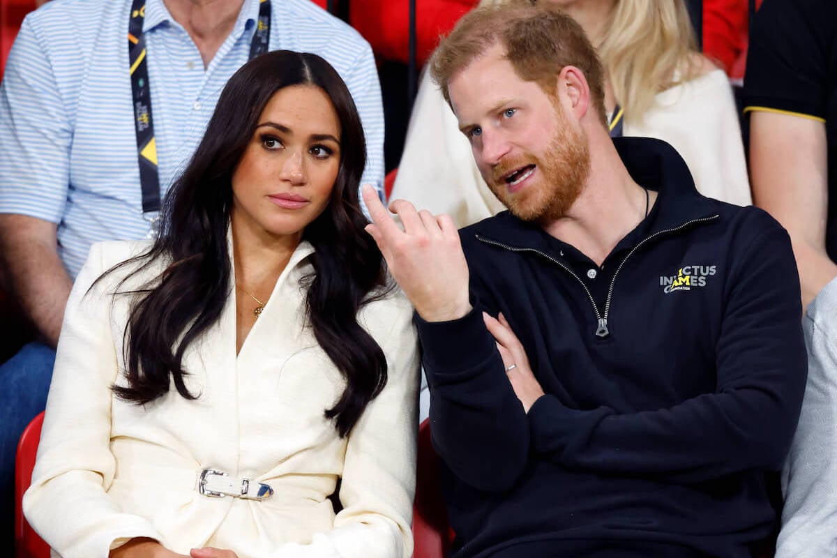 Meghan Markle and Prince Harry, who are, per an expert, poised for 'intense discussions' about their Hollywood projects, sit next to each other