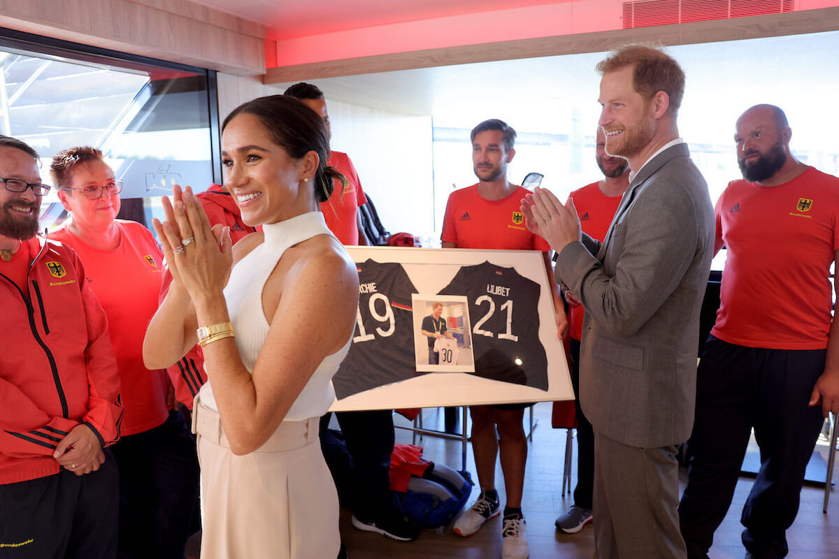 Meghan Markle and Prince Harry, whose son Prince Archie may have to ask permission to marry as sixth in the line of succession, at an Invictus Games event