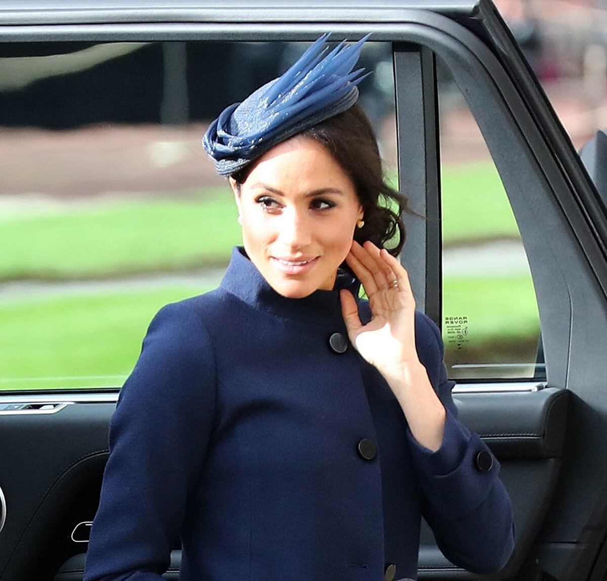 Meghan Markle, who received backlash after mock curtsy prompted video of best royal wedding curtsies, arrives to attend the wedding of Britain's Princess Eugenie at St George's Chapel, Windsor Castle