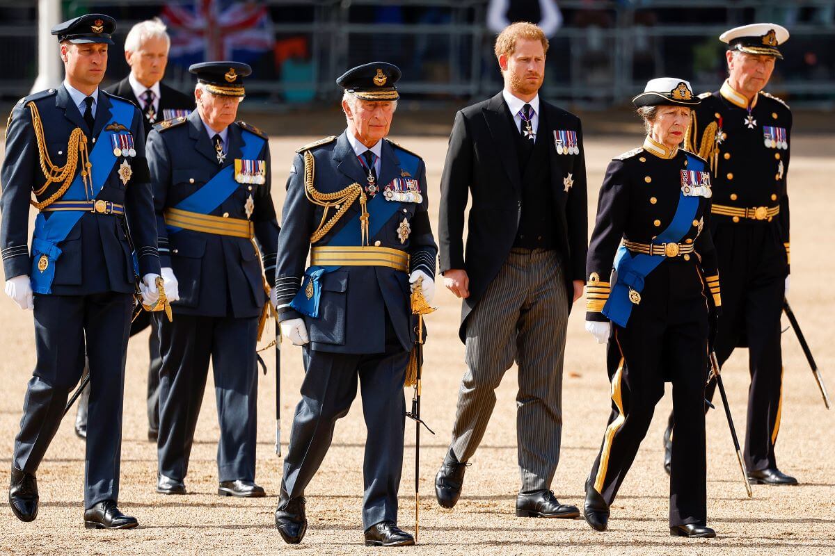 Members of the royal family including King Charles III and Prince Harry walk behind the coffin of Queen Elizabeth II during a procession from Buckingham Palace to the Palace of Westminster