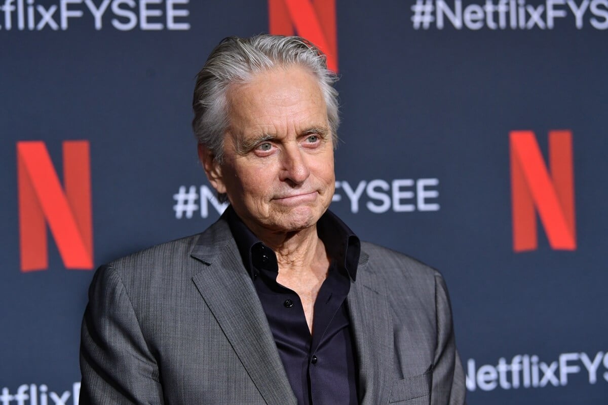 Michael Douglas posing in a suit at the Netflix premiere of 'The Kominsky Method'.