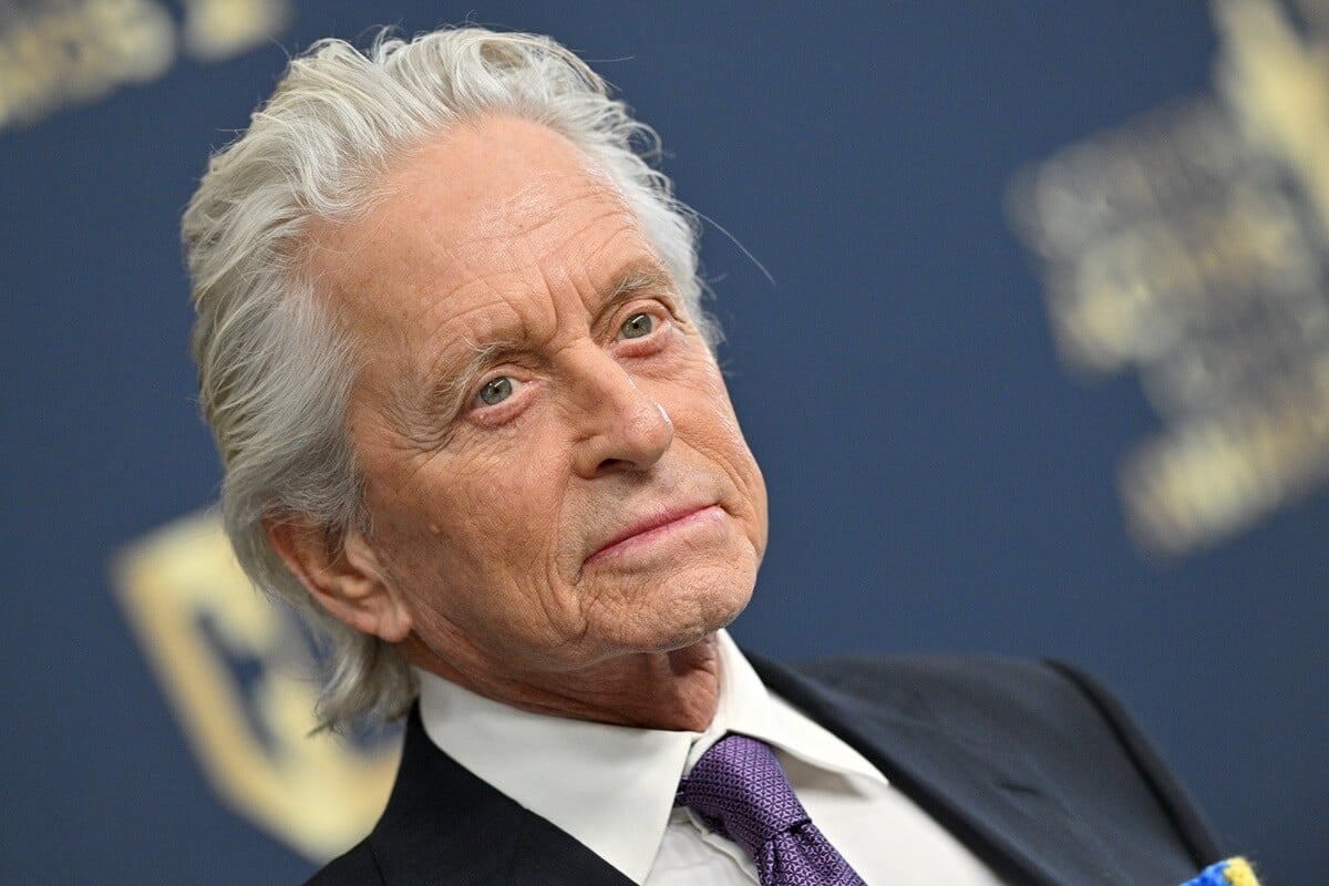 Michael Douglas posing in a suit at the the 28th Annual Screen Actors Guild Awards.