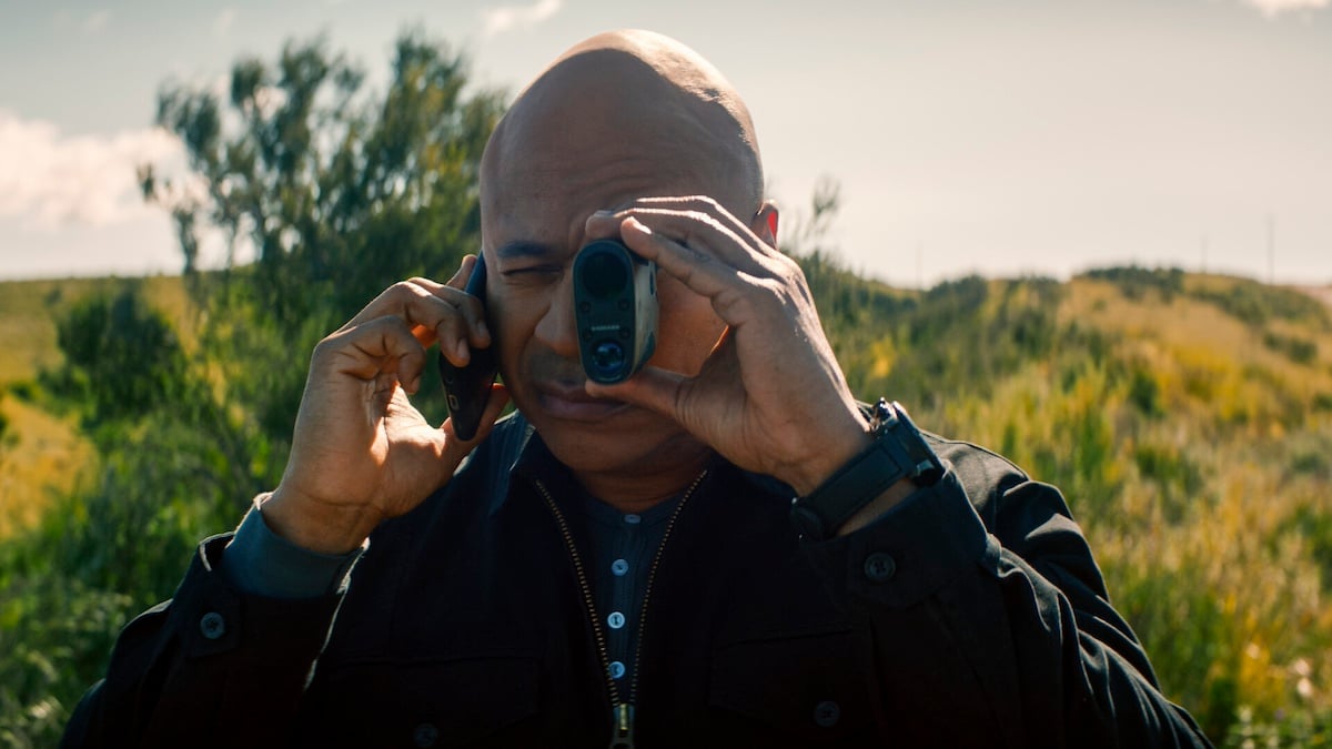 LL Cool J talking on the phone and looking through a telescope on 'NCIS: Hawai'i'