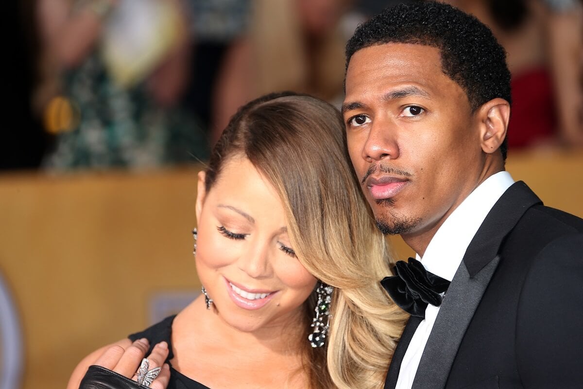 Mariah Carey and Nick Cannon dressed up and posing at the 20th Annual Screen Actors Guild Awards.
