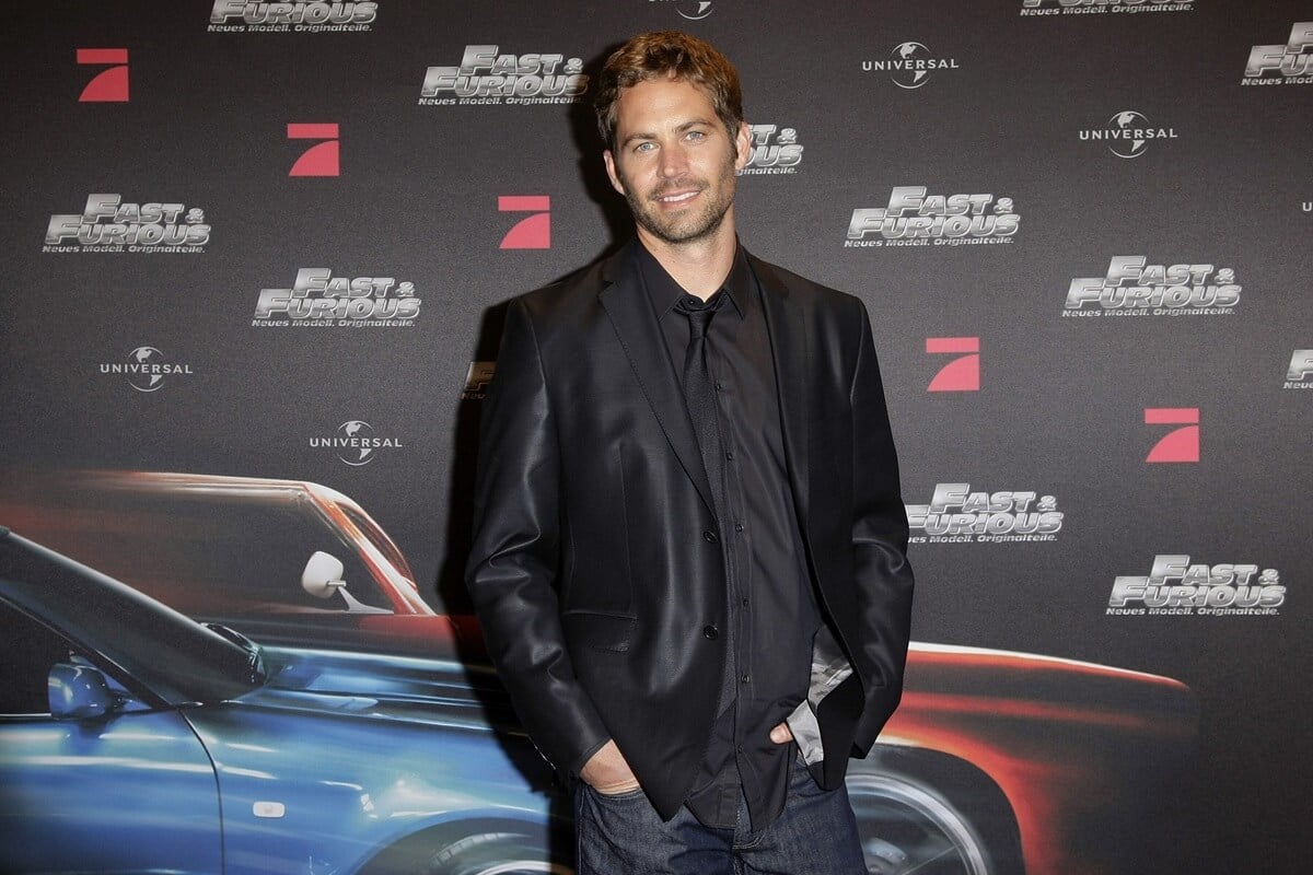 Paul Walker posing in a suit at the Europe premiere of 'The Fast and the Furious 4'.