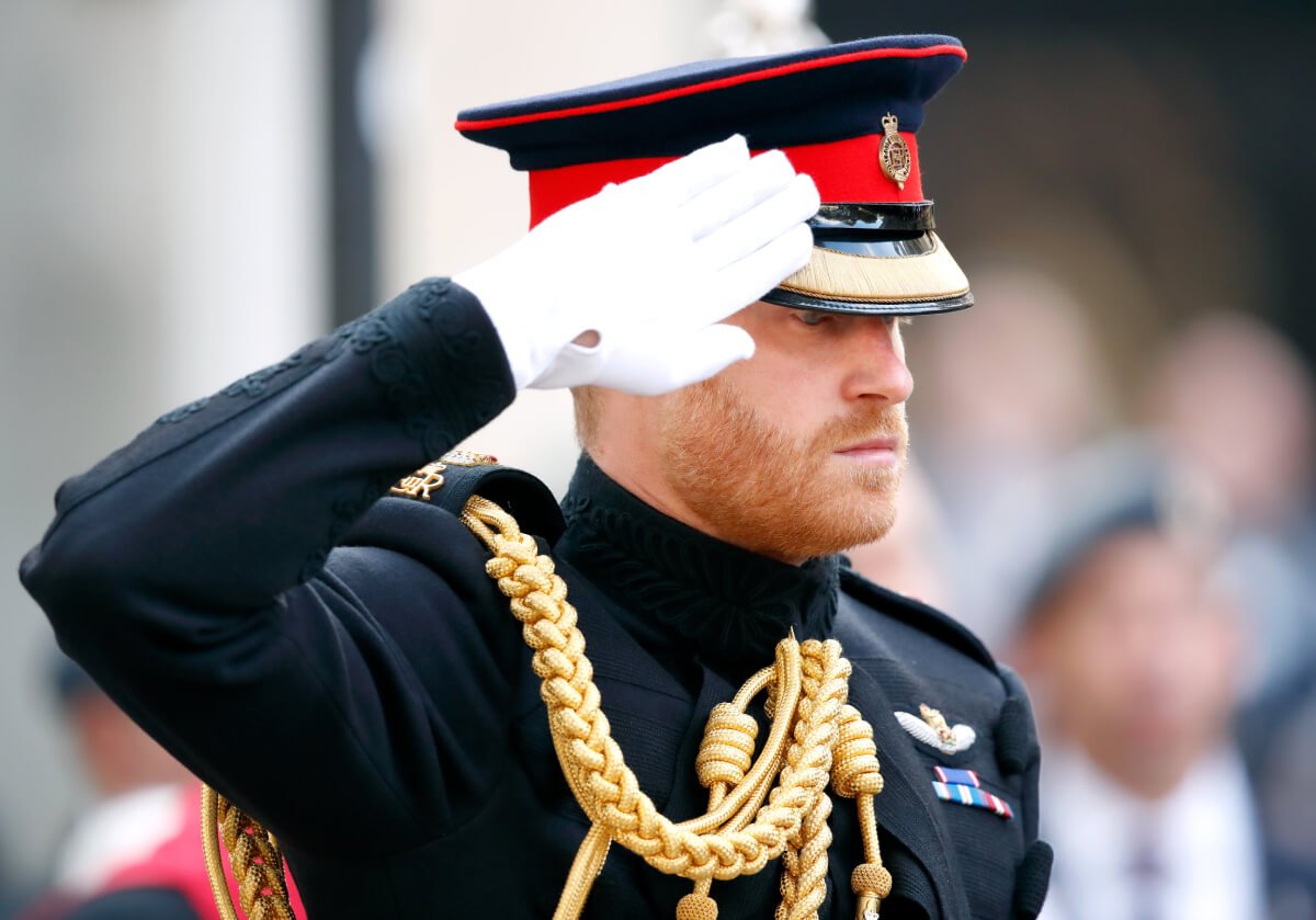 Prince Harry, Duke of Sussex salutes as he attends the opening of the Field of Remembrance at Westminster Abbey on November 8, 2018 in London, England