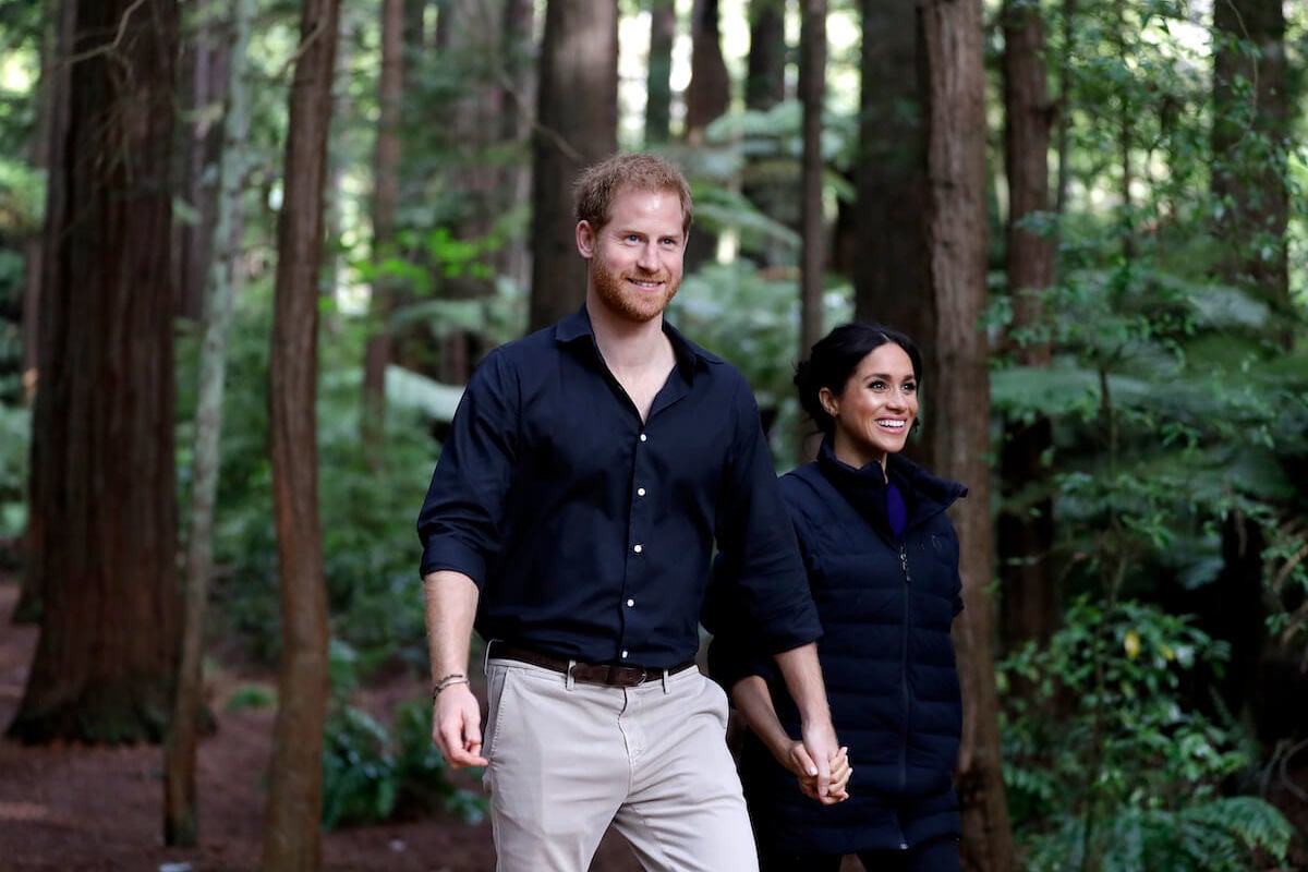 Prince Harry and Meghan Markle, who were photographed on Halloween night, 2023, with Prince Archie and Princess Lilibet, walk